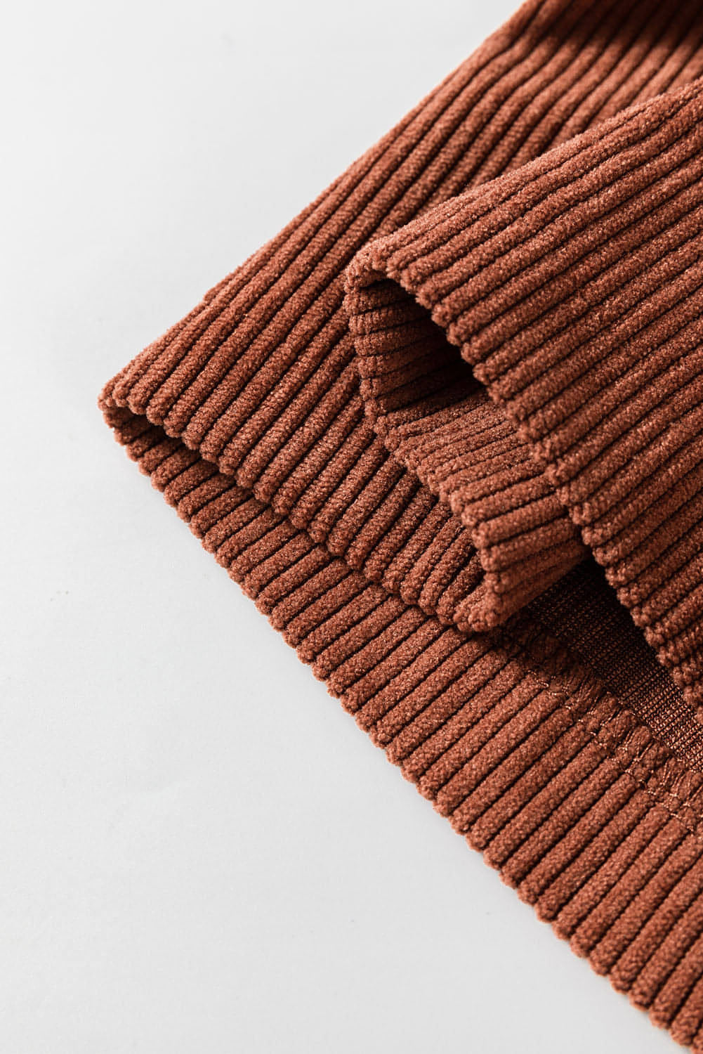 Brown high waist corduroy pants with square pockets by Carmine Juneberry, showcasing a stylish and comfortable fit.