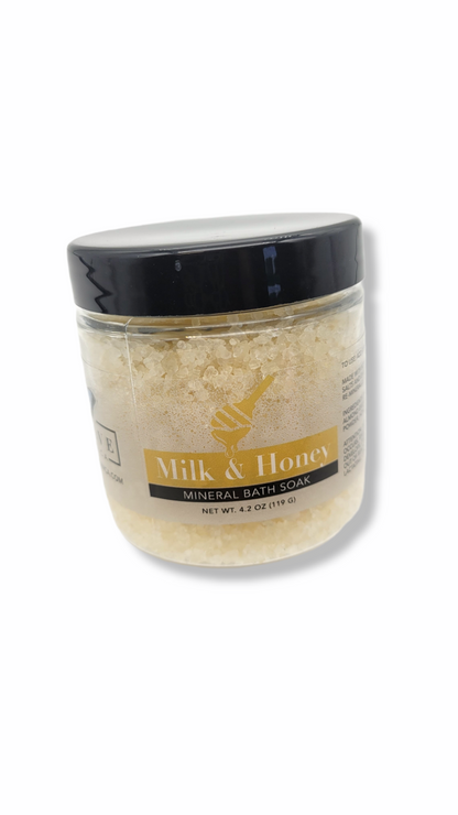 Start2Finish Milk &amp; Honey Mineral Soak mini bath salt jar with a white lid and colorful label, ideal for relaxing bath experiences.