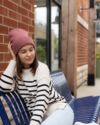 Azure Arrowwood HAAKWEAR knit cuffed beanie in rusty burgundy, close-up view showing soft knit fabric and cuffed brim.