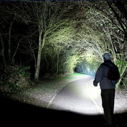 Black Lavender EcoGear FX TK120 LED tactical flashlights with strobe mode, positioned for camping use, in a 2-pack.