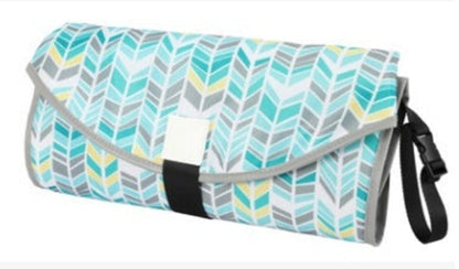 Baby changing pad from CJDropshipping, soft cushioned surface with safety straps for convenient diaper changes.