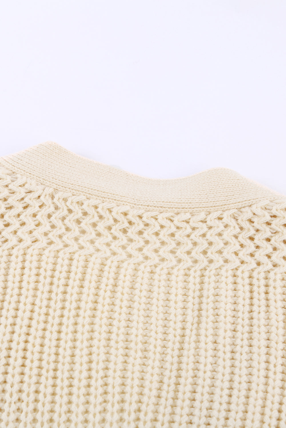Beige wrap V-neck sweater with side tie, stylish bath and beauty clothing by Harlequin Daisy, displayed on a neutral background.