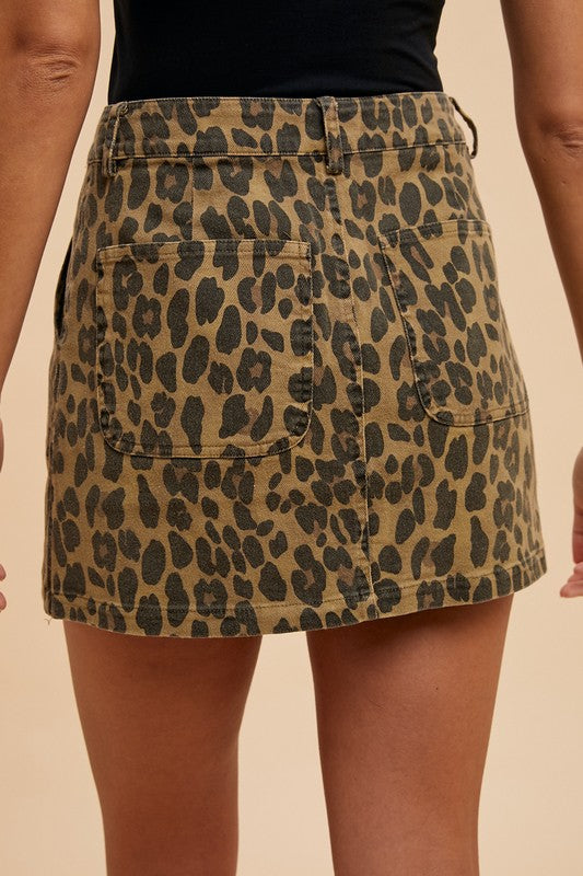Leopard print denim mini skirt for women by Jade Icarus, featuring a stylish, fitted design with a mid-rise waist.