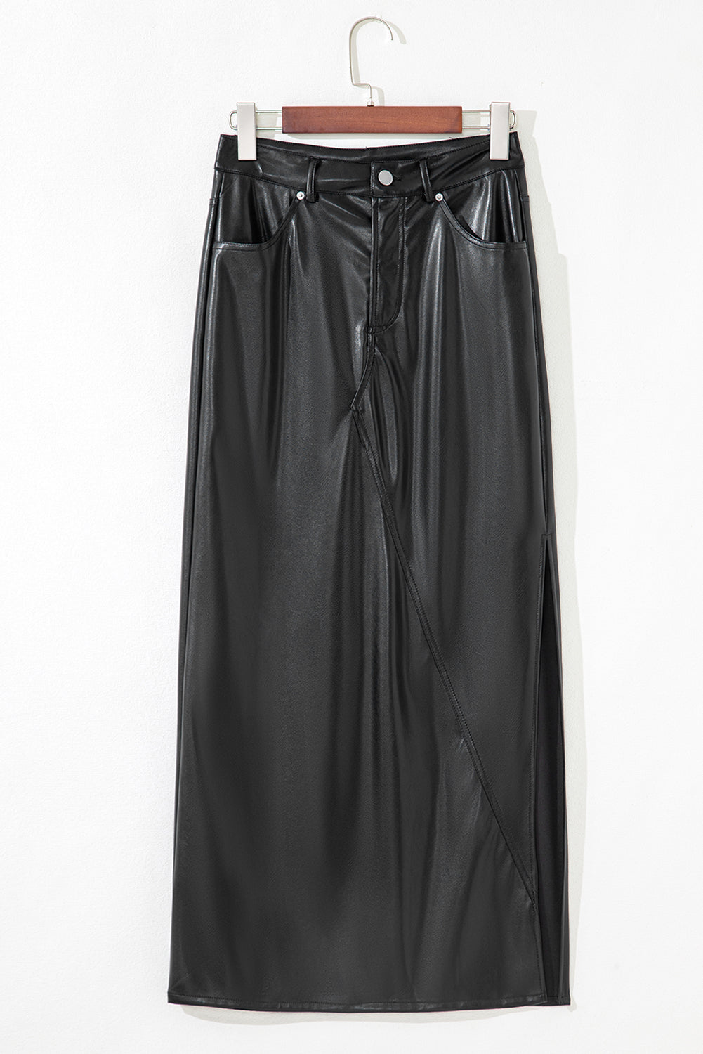 Black solid faux leather side slit maxi skirt for women by Byzantium Bay, featuring a sleek silhouette and stylish side slit detail.