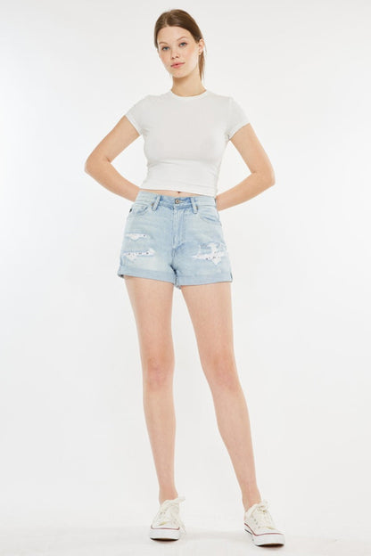 Jade Icarus Kancan high rise repaired mom denim shorts with distressed details and frayed hem, styled for casual wear.