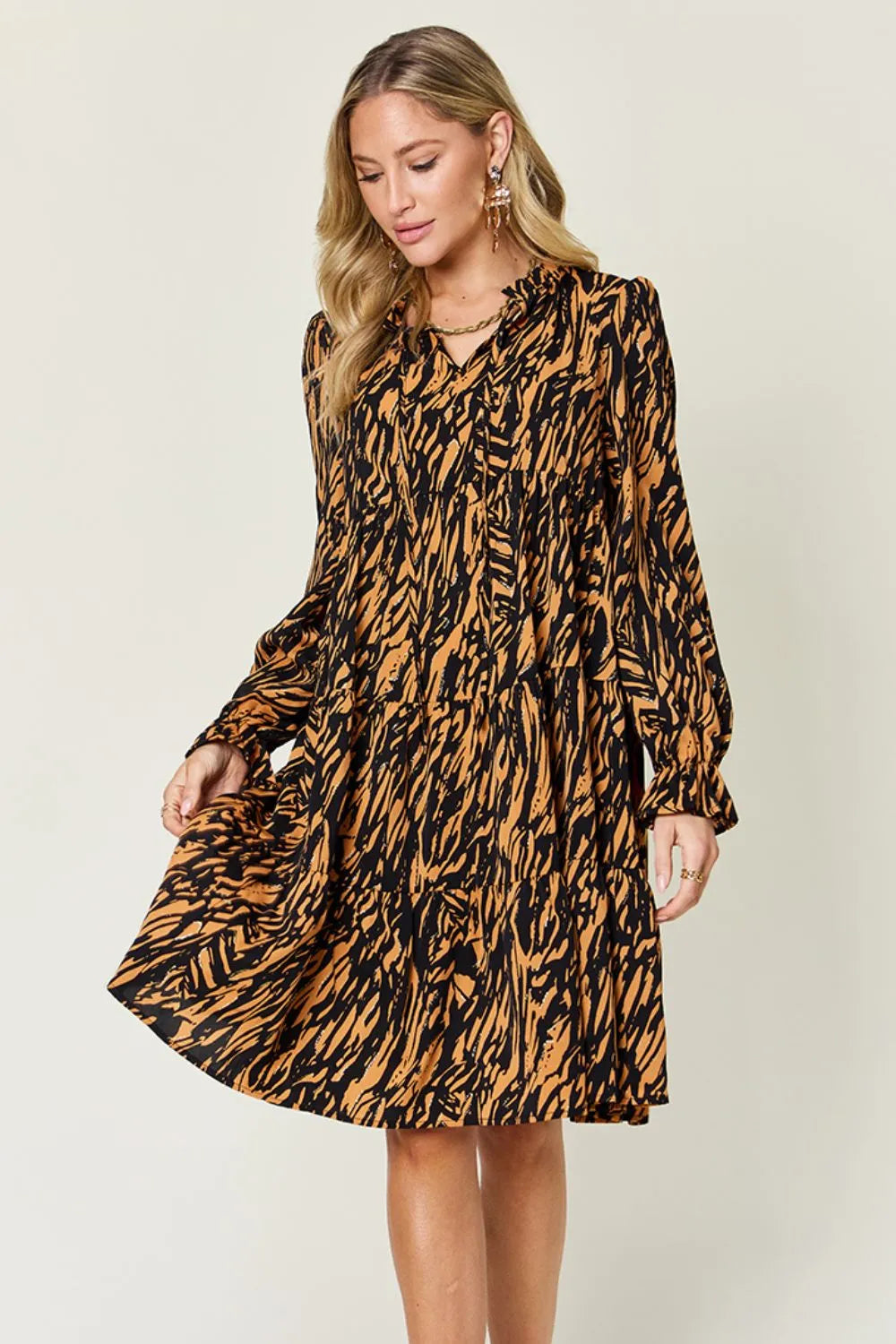 Pear Daisy double take full size printed ruffle hem long sleeve dress suitable for home and garden settings.