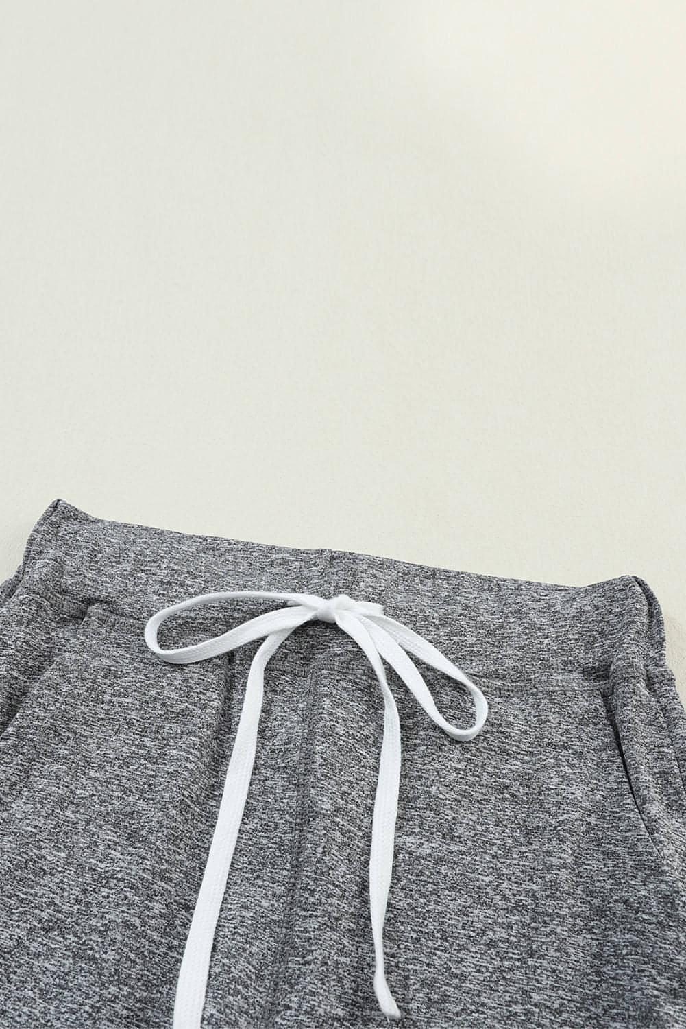 Gray Carmine Juneberry joggers with drawstring waist and side pockets, perfect for comfortable gifts.