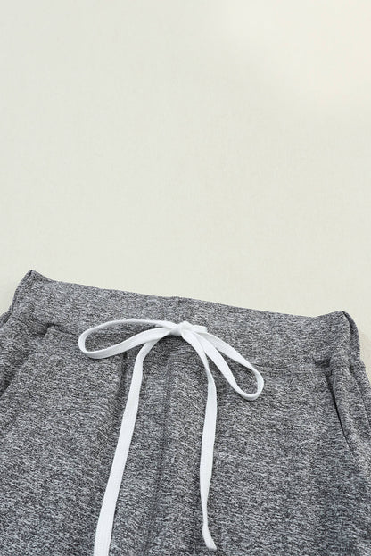Gray Carmine Juneberry joggers with drawstring waist and side pockets, perfect for comfortable gifts.