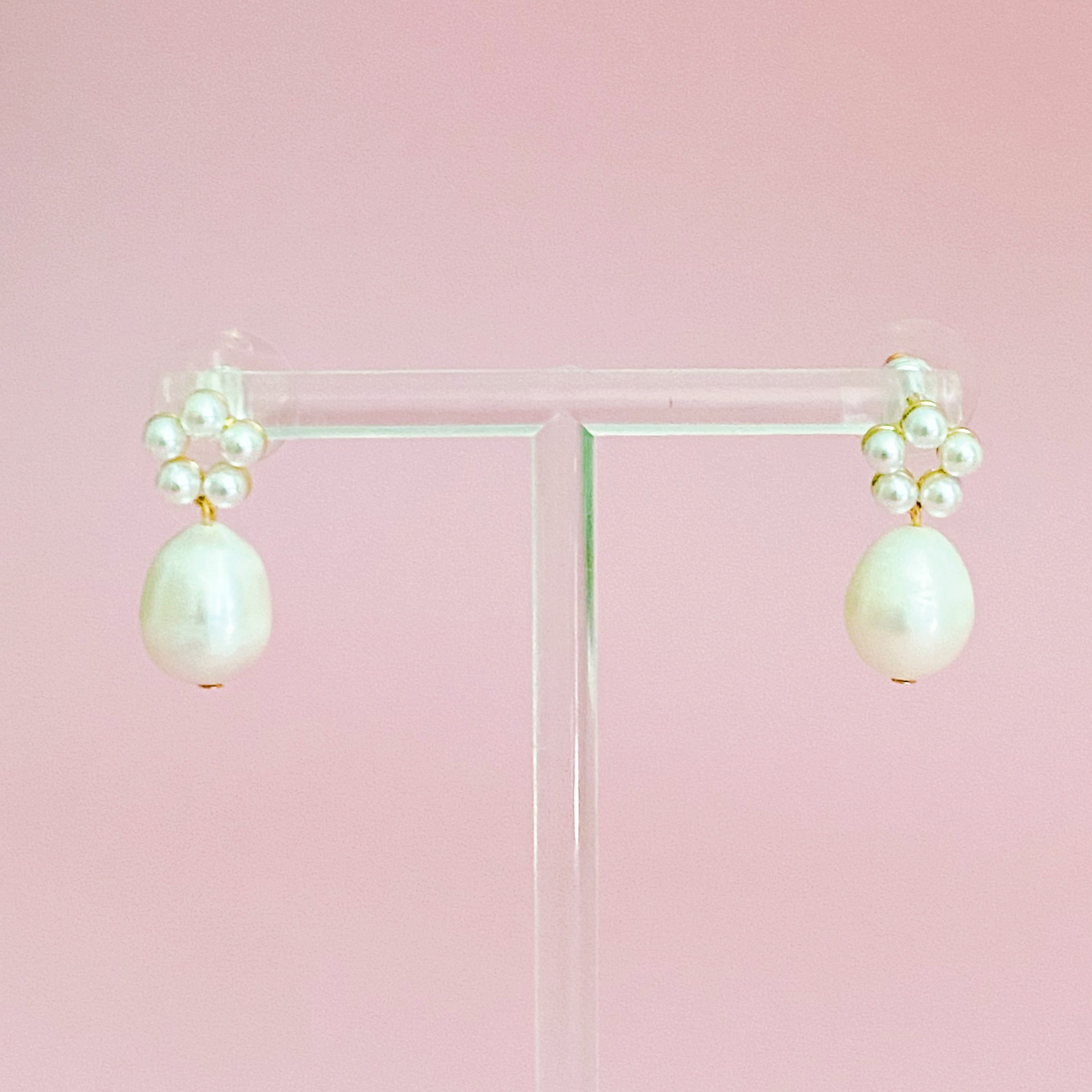 Fuchsia Hercules freshwater pearl drop earrings with elegant jewelry design featuring shimmering pearl pendants.
