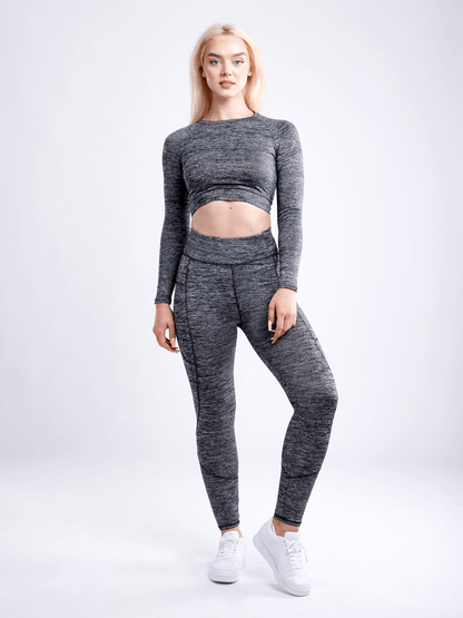 Black Lavender JupiterGear long-sleeve crop top, stylish activewear with a fitted design, shown in a sleek black fabric.