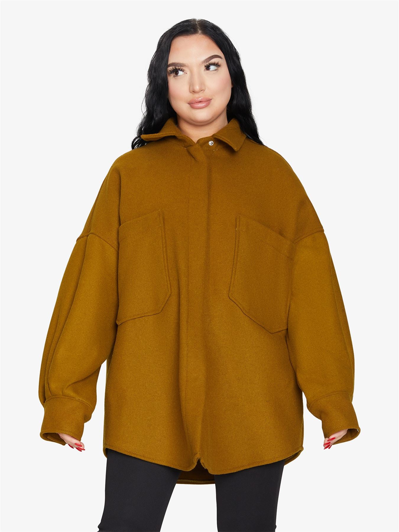Rose Eleusis oversized patch pocket shacket, a stylish jacket with large patch pockets and a relaxed fit, shown in natural fabric detail.