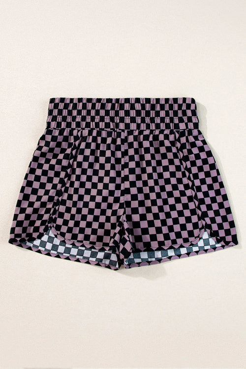 Byzantium Bay leopard and checker high waist athletic shorts displayed on a model, featuring bold print and comfortable fit.