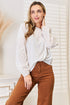 Shiny eyelet dropped shoulder round neck blouse by Pear Daisy, featuring metallic accents and a relaxed fit.