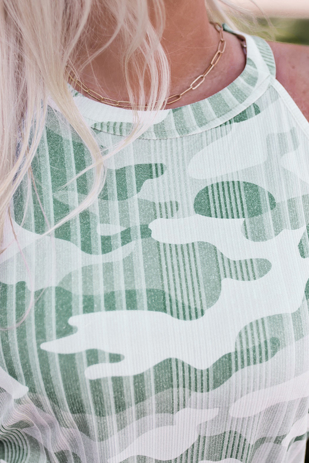 Green camo tank top from Harlequin Daisy, casual sleeveless style with a camouflage pattern, ideal for relaxed summer wear.