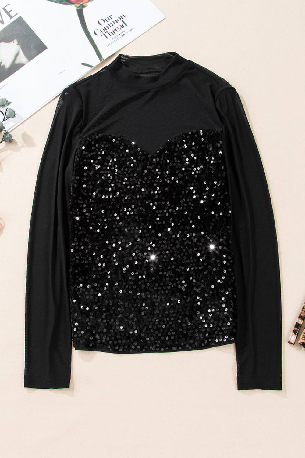 Black sequin velvet sheer mesh mock neck blouse by Carmine Juneberry, featuring a stylish, elegant design with shimmering details.