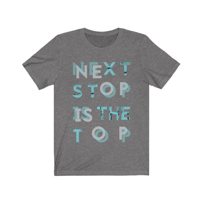 Plum Charlie "Next Stop is The Top" T-shirt featuring bold typography on a casual cotton shirt.