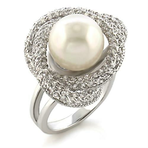Rhodium brass ring with a white synthetic pearl, elegant jewelry piece by Turquoise Tiger featuring a polished band and pearl accent.