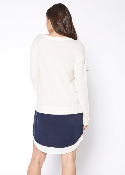 Women’s ivory Lemon Hera Twofer Pullover Sweater Dress, soft knit fabric, long sleeves, and cozy style, shown on a hanger.