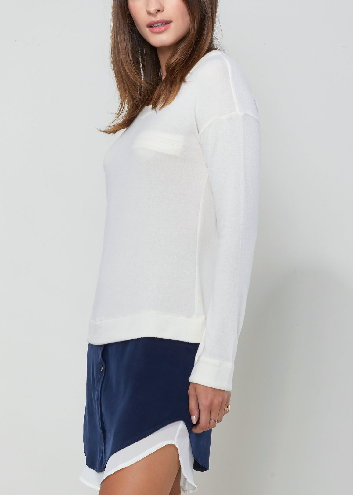 Women’s white Twofer Pullover Sweater Dress by Lemon Hera, cozy knit dress with layered look, long sleeves and ribbed details.