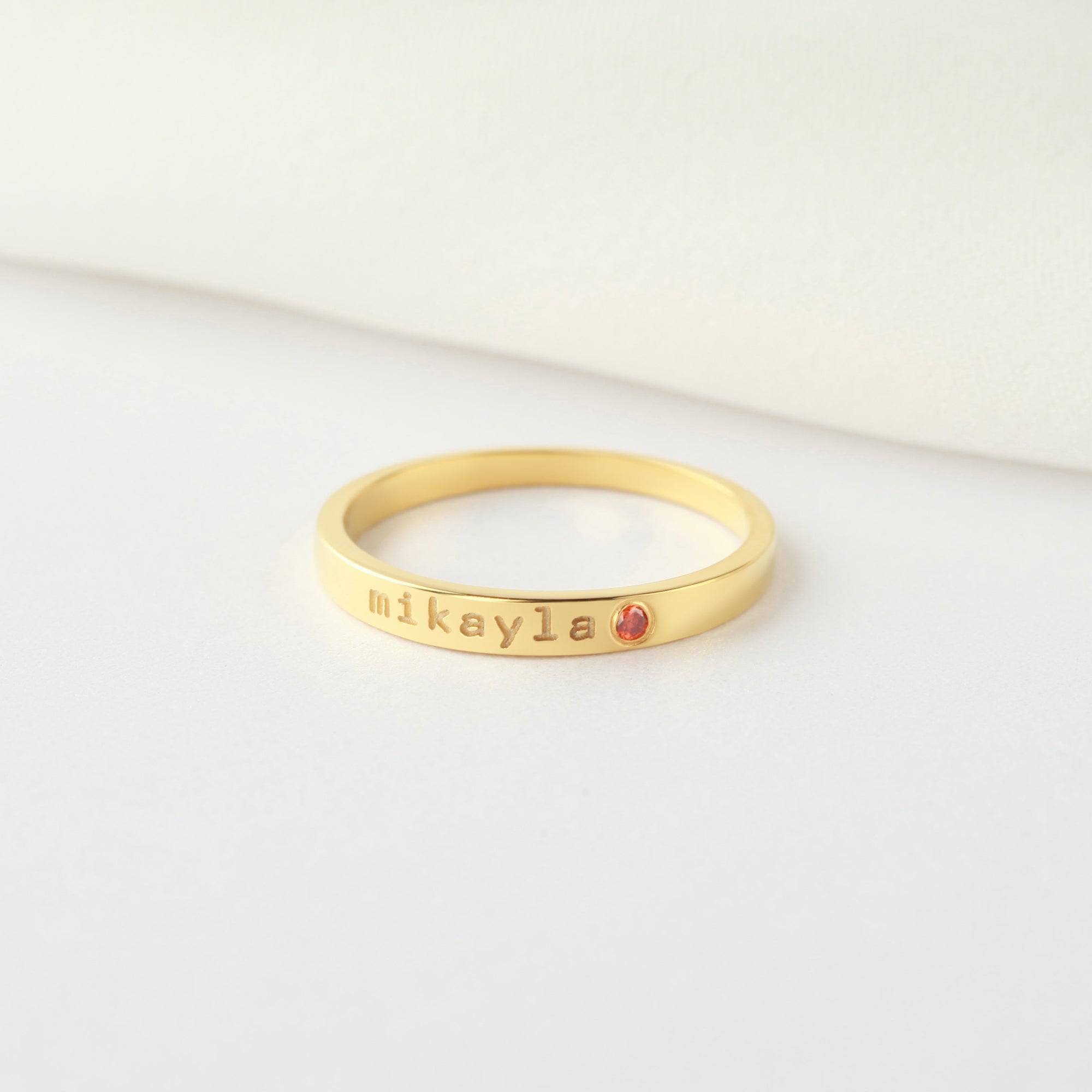 Personalized green millie name ring with birthstone, stackable mom ring featuring engraved name and gemstone accent.