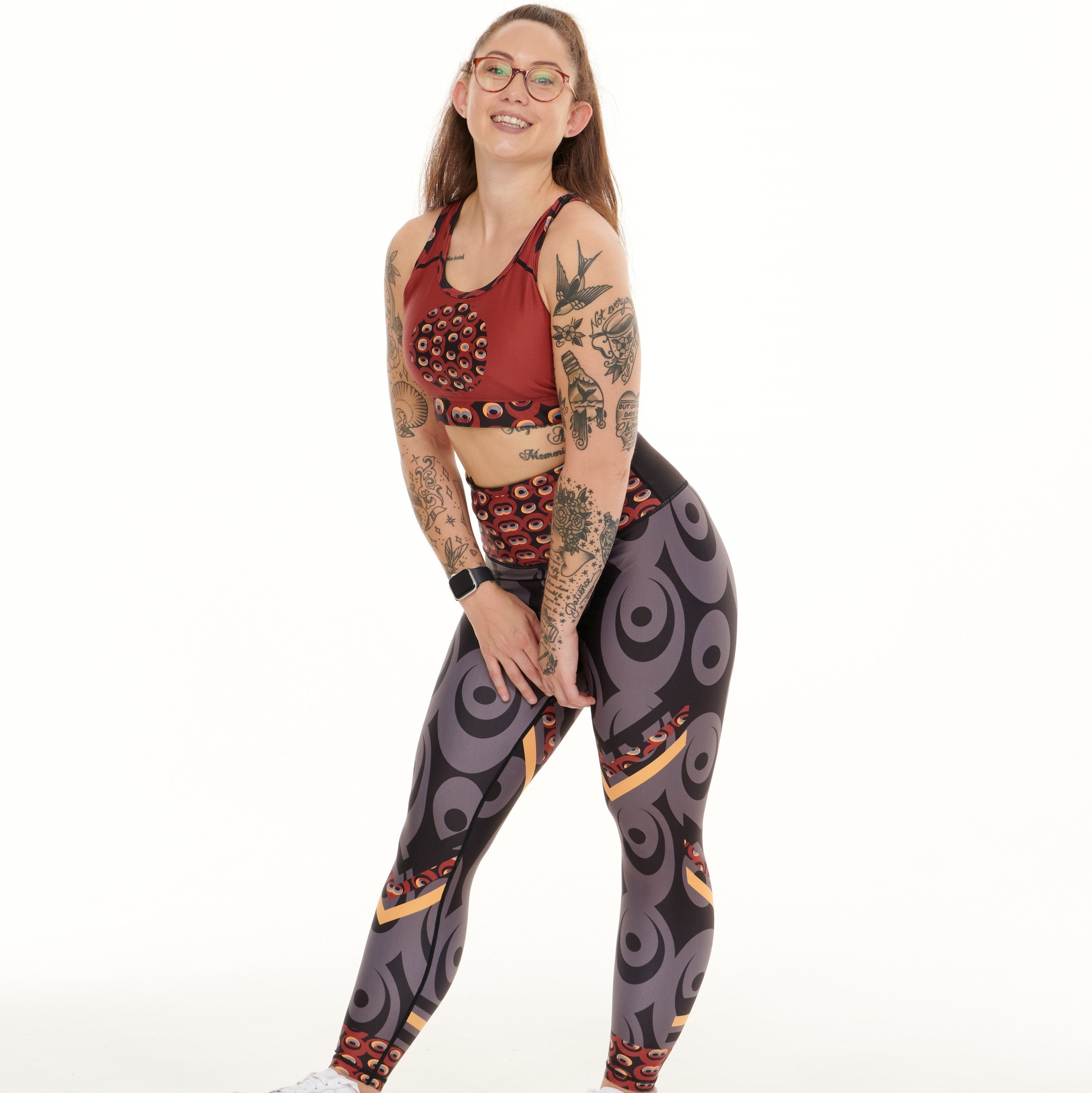 White Oliver Siefay On Iron Red Splash activewear leggings with bold red splash design on black fabric, suitable for workout and athletic wear.