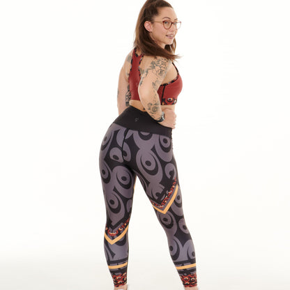 Red splash patterned Siefay On Iron leggings by White Oliver, activewear with a bold, vibrant design, shown on a model.