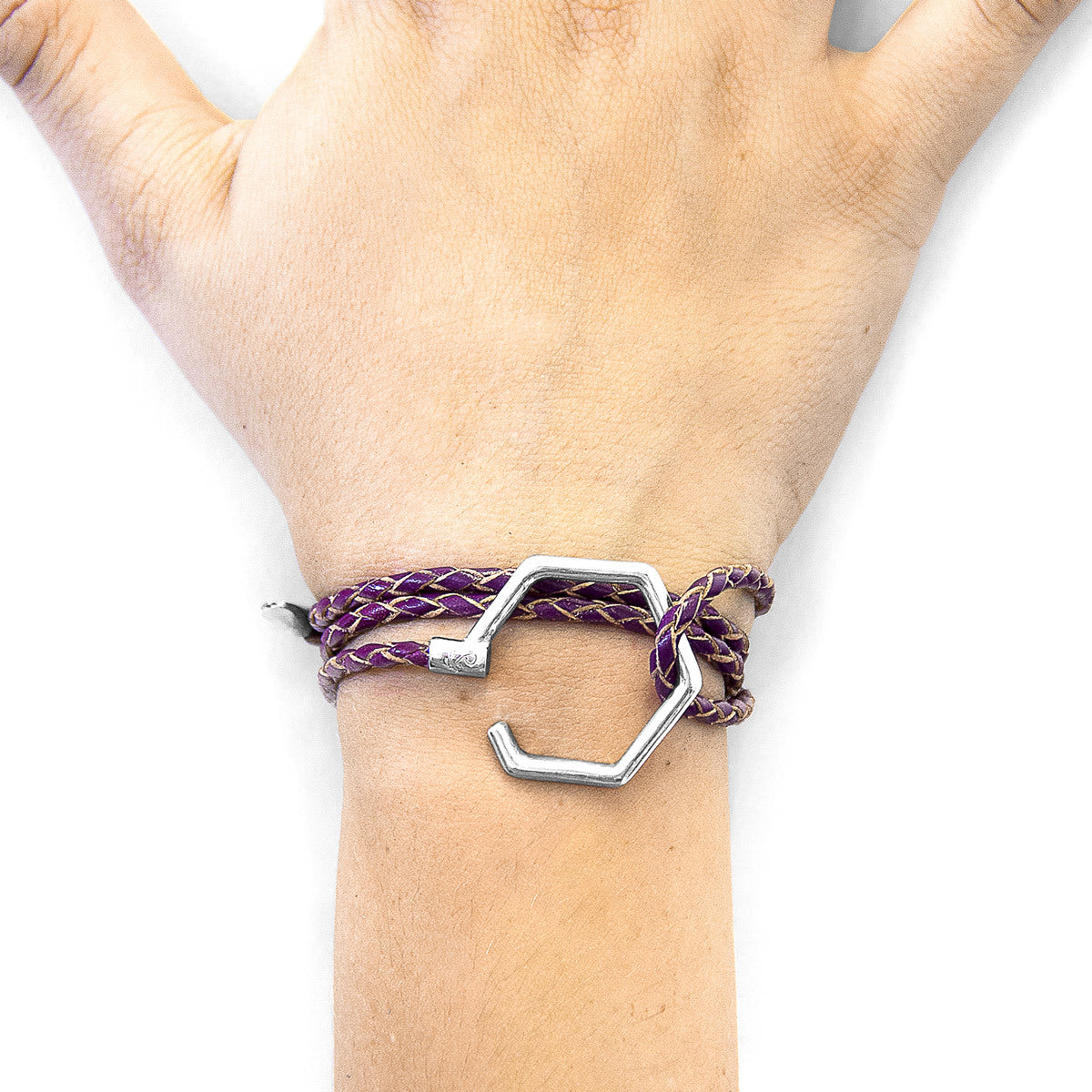 Deep purple storey silver and leather bracelet by Magenta Sooty with layered silver accents and leather strap detail.