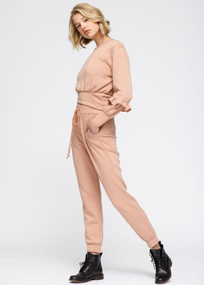 Lemon Hera peach crewneck sweatshirt with ruffle sleeves and peplum detail, casual sweater for stylish comfort.