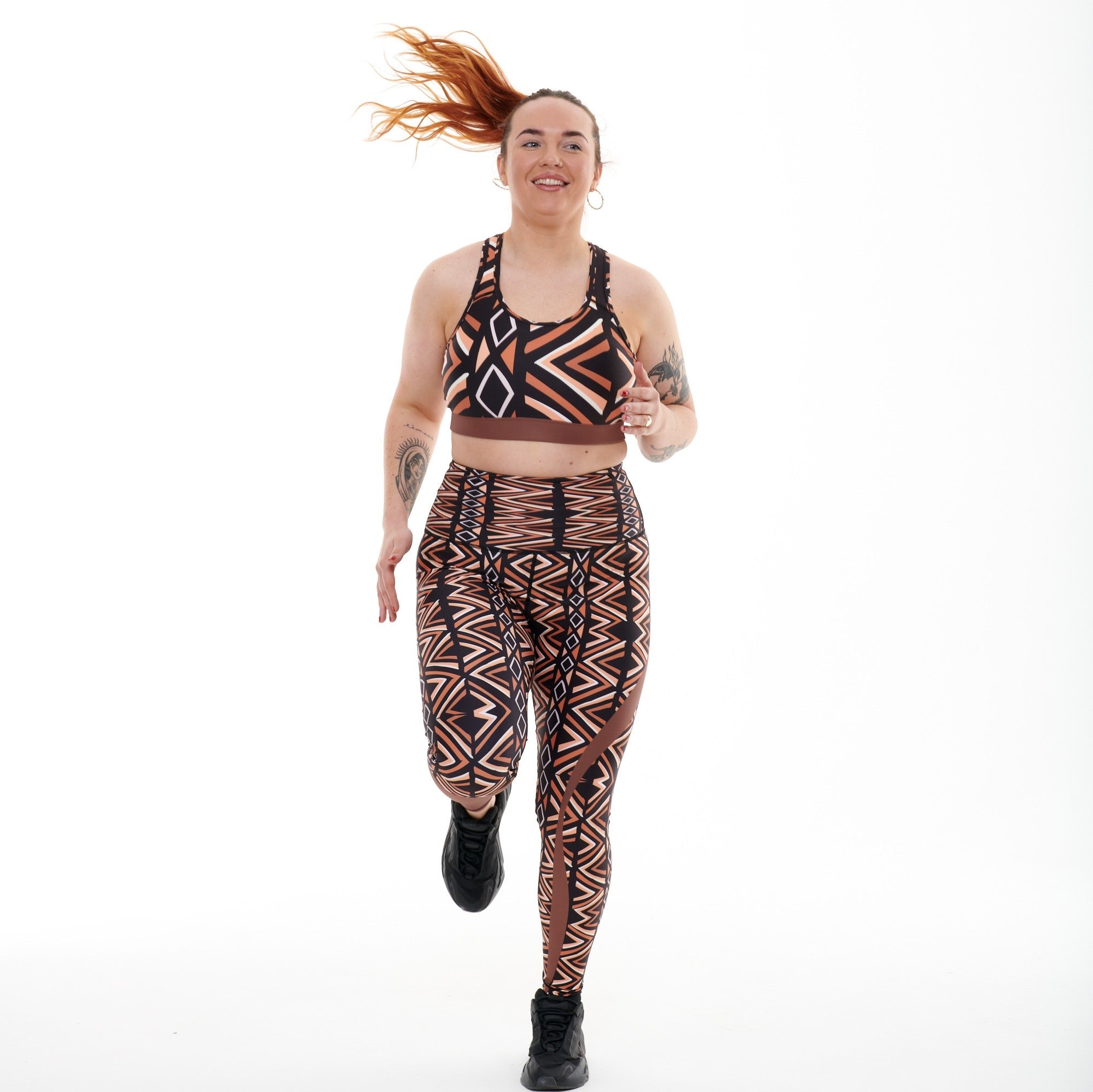 White Oliver Ibeekay Vibrant Activewear Leggings with colorful abstract pattern on a model standing outdoors