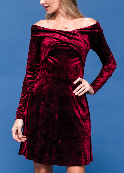 Burgundy velvet off-shoulder dress from Lemon Hera, featuring a fitted bodice and flowing skirt, styled for elegant occasions.