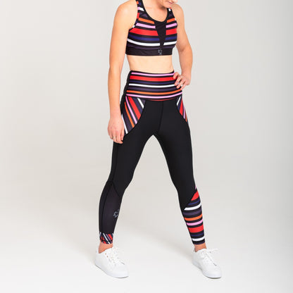 White Oliver Aso-Oke leggings for activewear featuring vibrant, traditional Nigerian fabric design and a comfortable fit.
