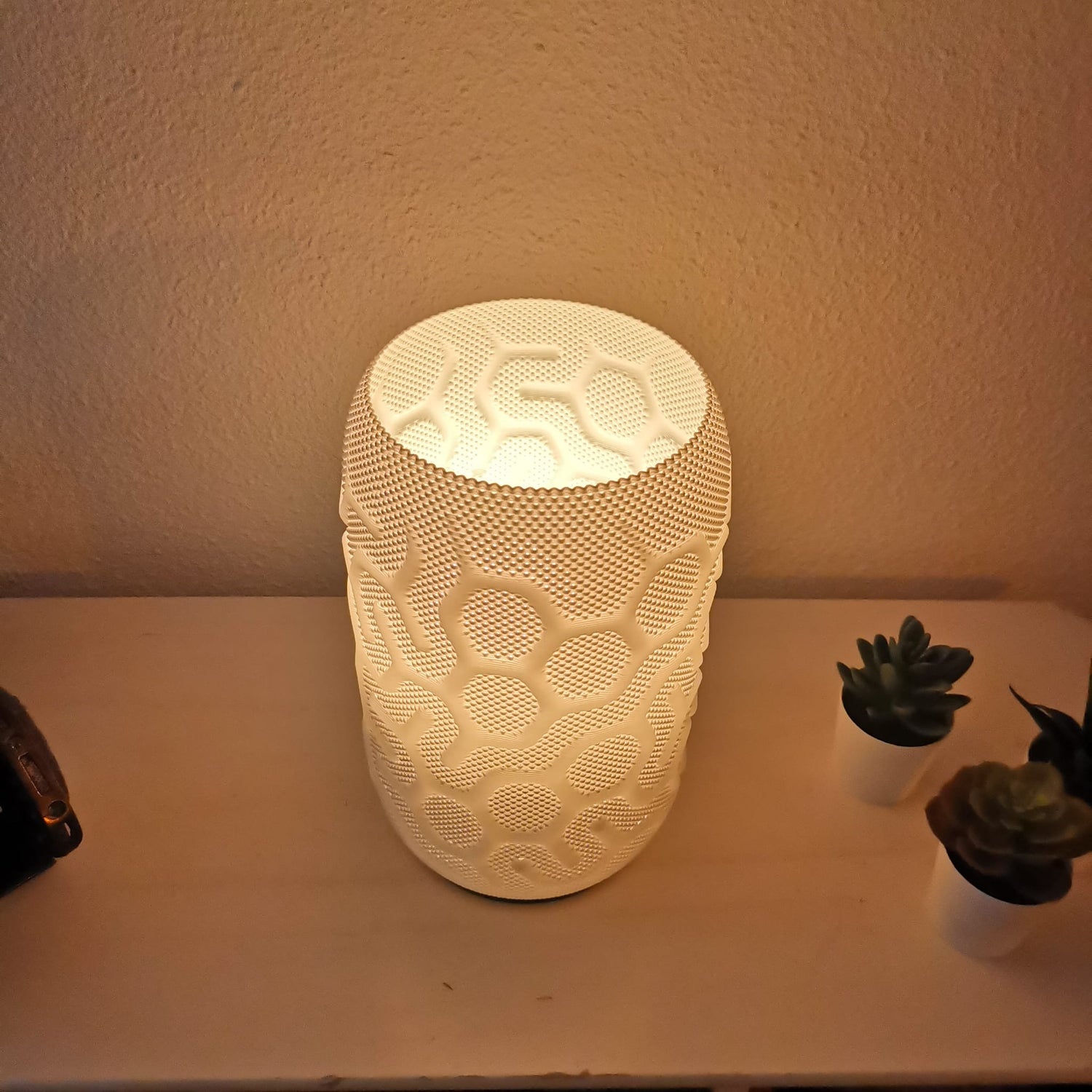 Azure Pontus Aether Glow lighting fixture with a sleek, modern design, showcasing its illuminated, glowing surface.
