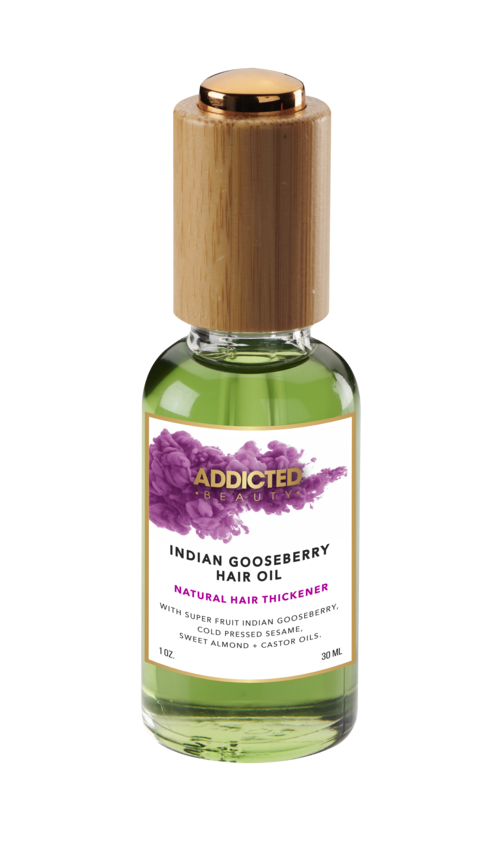 Yellow Bittercress Addicted Beauty Indian Gooseberry Natural Hair Oil bottle on a bath and beauty setup, showcasing the product packaging.