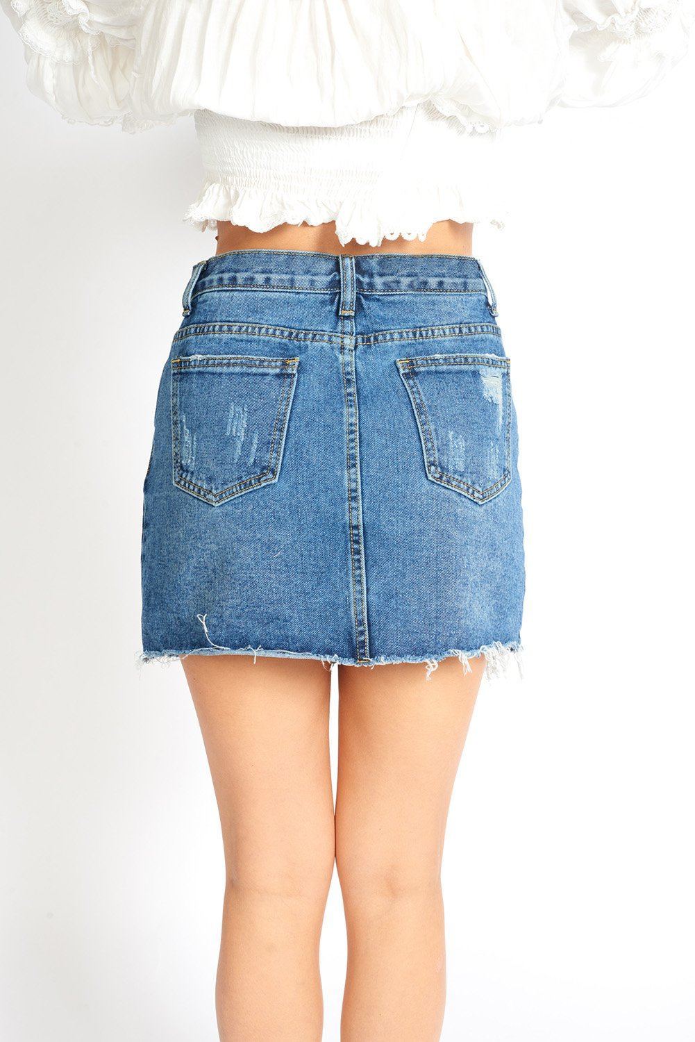 Dark blue Amalia ripped denim mini skort for women from Azure Thanatos, showcasing distressed denim and stylish design.