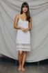 Polkadot lace slip dress by Periwinkle Aether featuring delicate lace and a flowing silhouette.