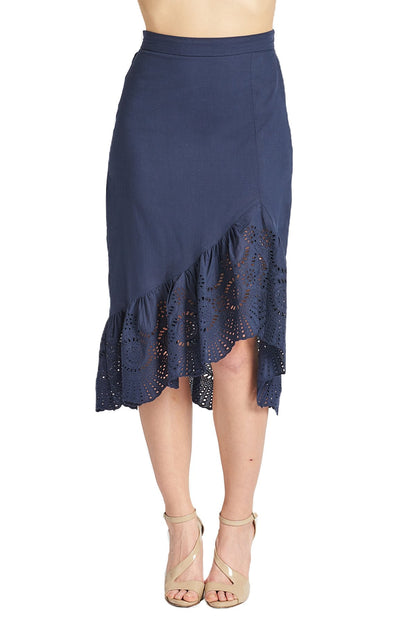 Navy cotton eyelet Aster Skirt by Peach Dionysus featuring an asymmetric hi-lo hem and floral eyelet details.
