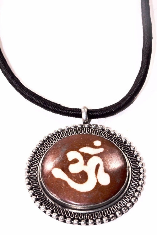 Silver Hestia auspicious Om spiritual necklace featuring a pendant with Om symbol on a silver chain.