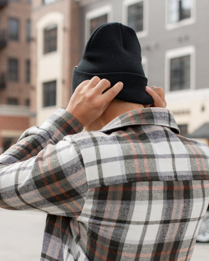 Azure Arrowwood HAAKWEAR Knit Cuffed Beanie in Dune Beige, soft warm hat with a snug cuff and cozy knit texture.