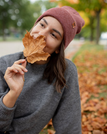 Azure Arrowwood HAAKWEAR Rusty Burgundy knit cuffed beanie hat with a cozy, textured knit design.
