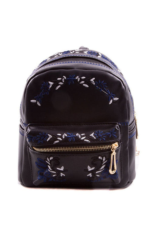 Lavender Tartarus embroidered backpack with floral design, featuring adjustable straps and front pocket, on a neutral background.