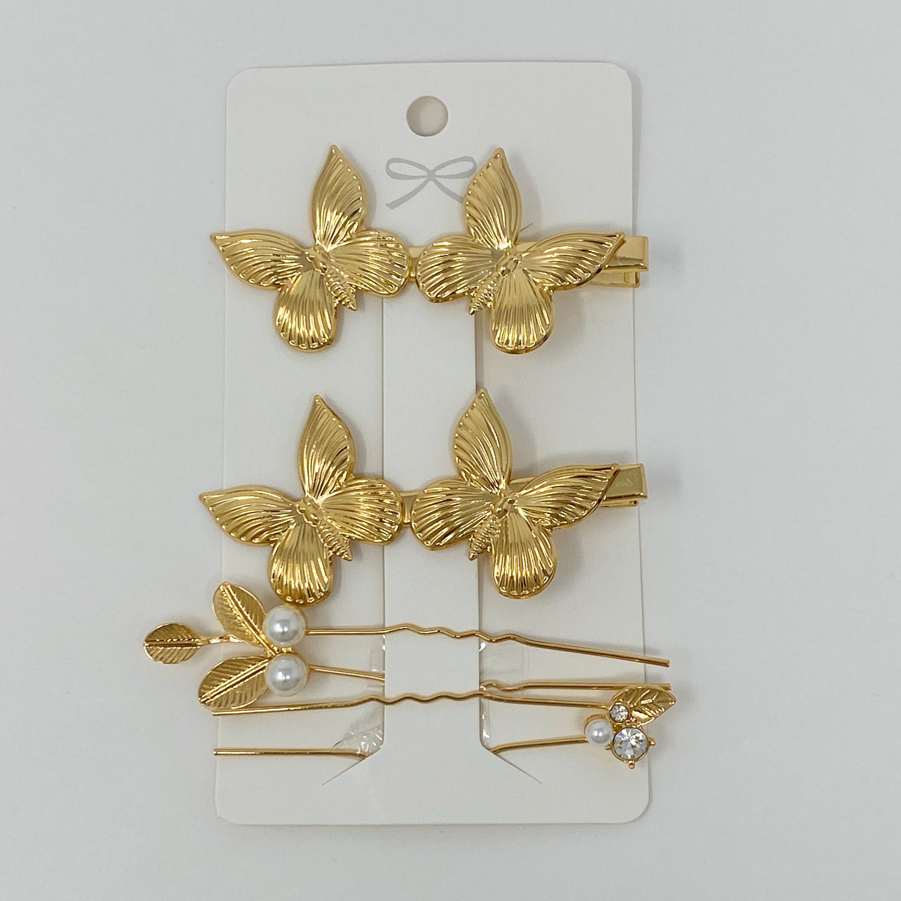 Antique garden-themed hair clip set by Fuchsia Hercules, vintage jewelry accessories with floral and ornate details.