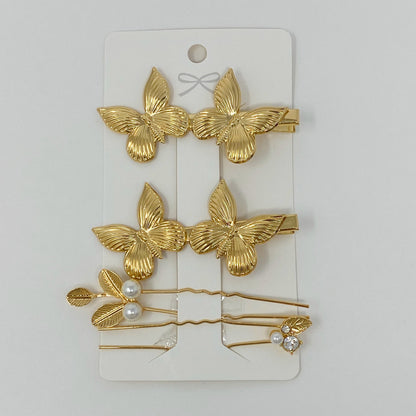 Antique garden-themed hair clip set by Fuchsia Hercules, vintage jewelry accessories with floral and ornate details.