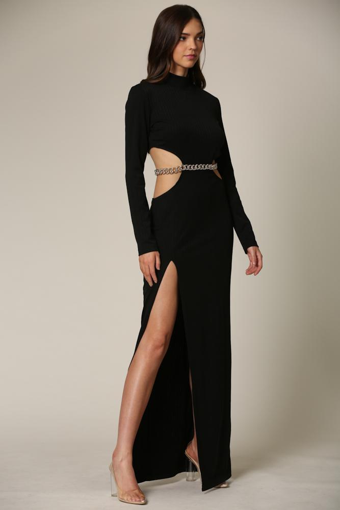 White Amphitryon long sleeve ribbed maxi dress with high neck and cutout waist, shown on a model in a stylish indoor setting.