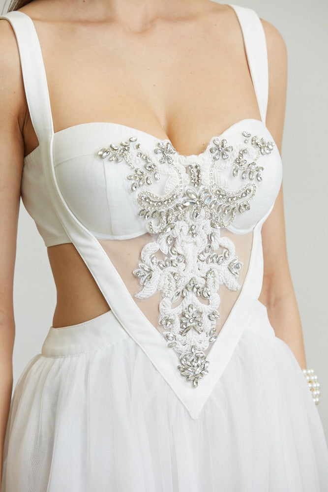 Close-up of the White Amphitryon Winona Dress showing detailed fabric and design elements, women&