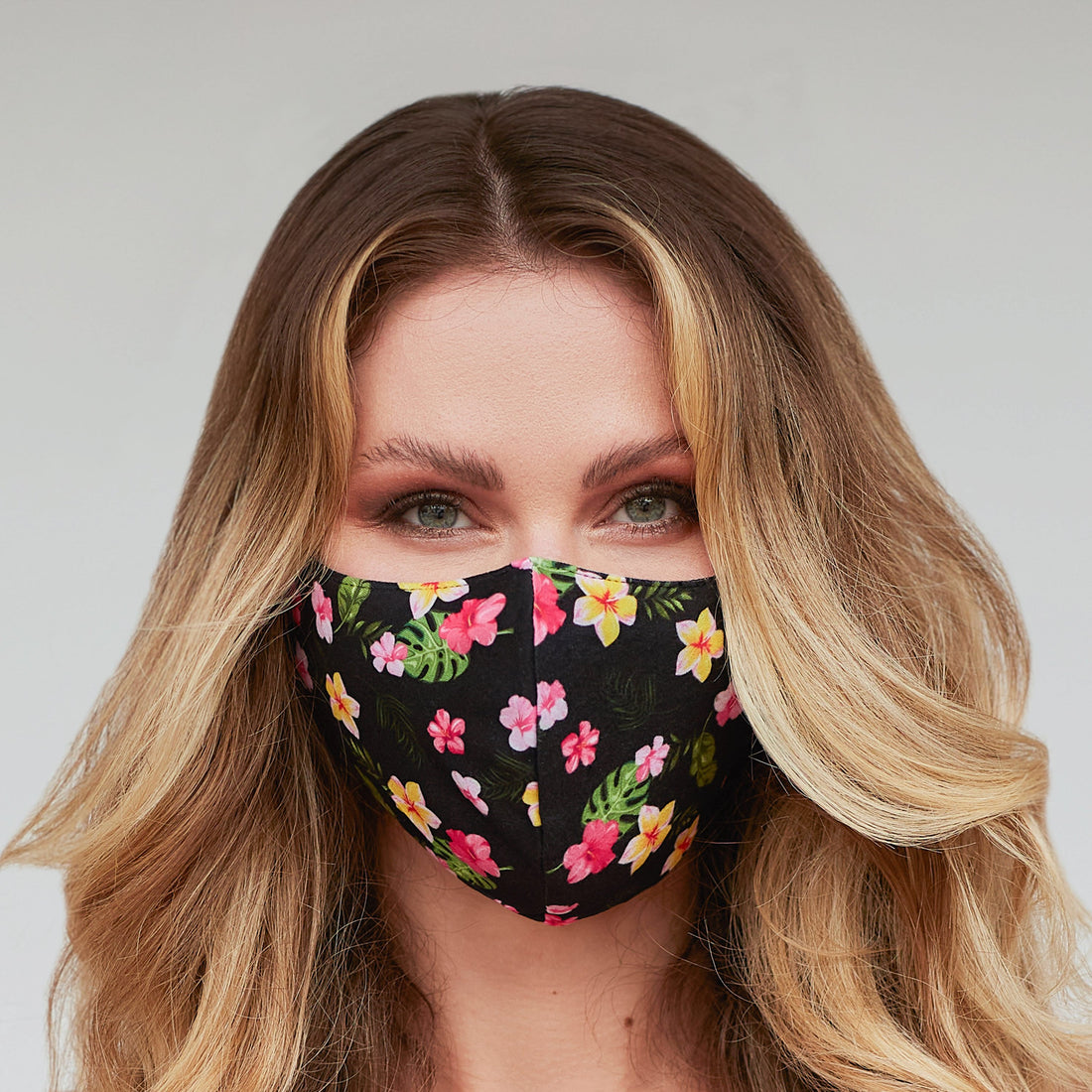 Black floral face mask for women by Cyan Poppy, showcasing a stylish floral pattern on soft fabric.