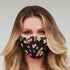 Black floral face mask for women by Cyan Poppy, showcasing a stylish floral pattern on soft fabric.