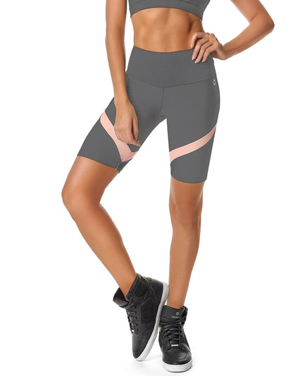 Red Medusa Calle Ocho women’s biker shorts, activewear with a fitted design and bold color, shown on a model.