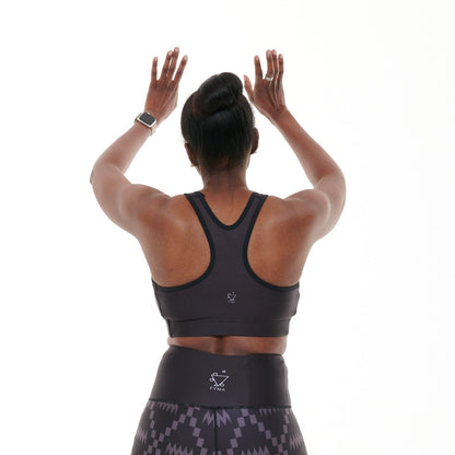 White Oliver B.G.W.E sports bra, activewear top with supportive fit, shown in a vibrant color on a plain background.