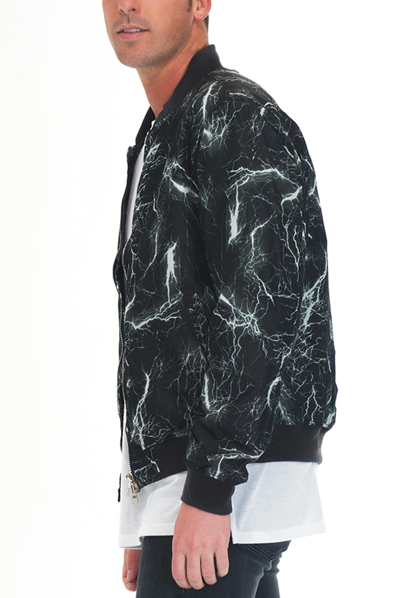 Lime Milo Bolt Print Bomber jacket with bold black and white geometric pattern, front zipper, and ribbed cuffs and collar.