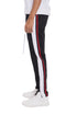 Black striped tricot track pants from Lime Milo with a relaxed fit and elastic waistband, suitable for casual wear.